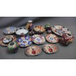 A collection of Japanese imari style porcelain to include a charger, vases, ginger jars, dishes etc.