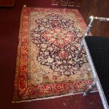 A fine North West Persian Sarouk rug with central double pendant medallion with repeating petal