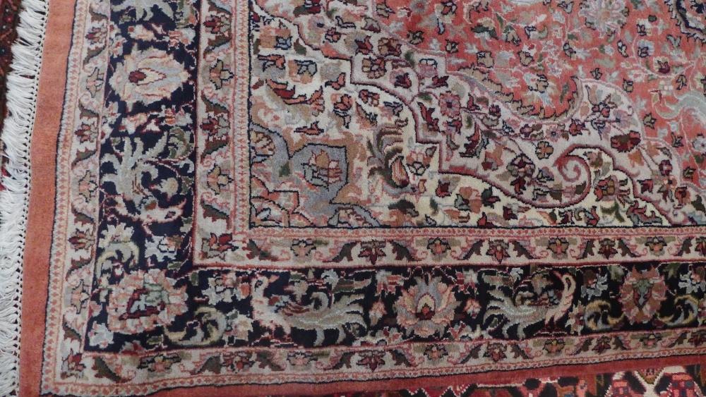 A North West Persian carpet with central floral medallion surrounded by repeating floral motifs - Image 4 of 5