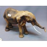 A ceramic elephant, H:32cm L:60cm