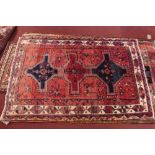A fine North West Persian Kurdle rug, with triple pole medallion on a terracotta field within