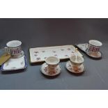 A pair of Limoges porcelain cups and saucers, together with a Czech porcelain tray and cups and