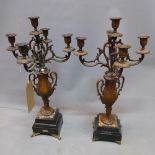 A pair of late 19th century French five light, four branch bronze candelabra, raised on twin handled