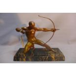 An Art Deco spelter sculpture of an archer, signed F. Douwe, raised on marble base. H-41 W-50 D-17cm