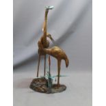 A bronze water fountain in the form of two herons, H: 109cm