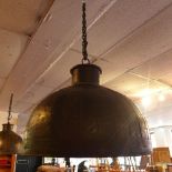 A large industrial ceiling light shade