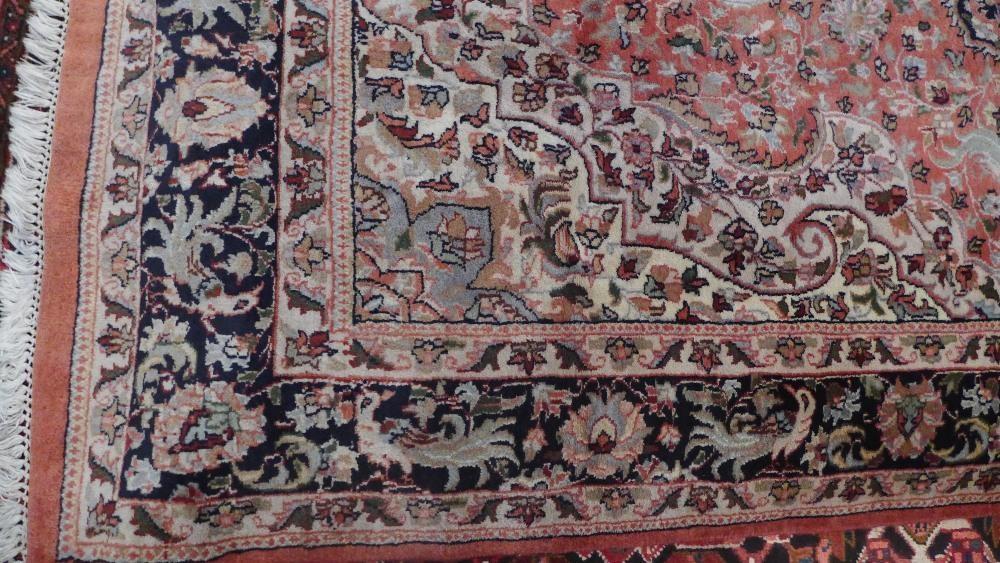 A North West Persian carpet with central floral medallion surrounded by repeating floral motifs - Image 3 of 5