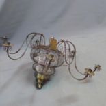 A 20th century wirework eight branch chandelier