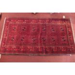 A fine North West Persian Turkoman rug with twelve elephant foot motifs within squares, surrounded