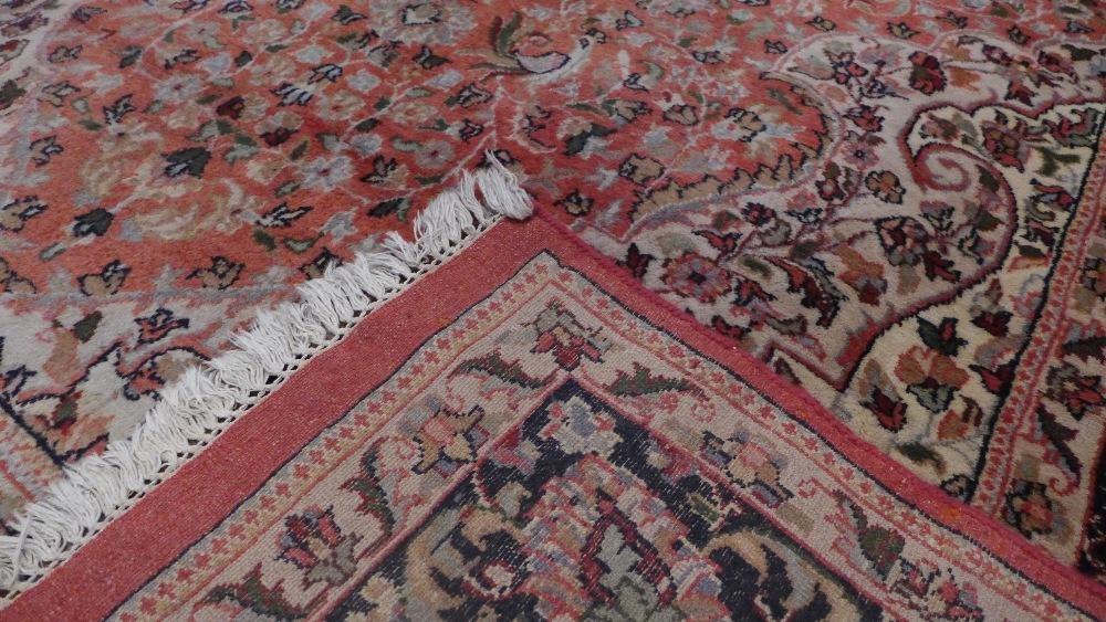 A North West Persian carpet with central floral medallion surrounded by repeating floral motifs - Image 5 of 5