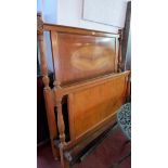 An early 20th century French walnut bed frame