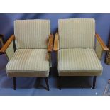 A pair of 1940/50's german cocktail armchairs with green velour upholstery raised on tapered legs.