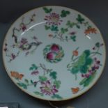 A Chinese famille rose plate, hand painted with flowers, bears four character mark to base, diameter
