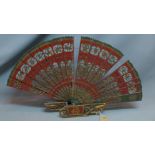 A Chinese lacquered ornamental fan with stand