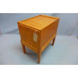 An early 20th century light oak tambour top filing box raised on stand with tapered legs. H-68 W-