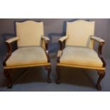 A pair of Gainsborough style mahogany armchairs with cream suede upholstery raised on cabriole
