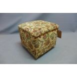 A 20th century ottoman foot stool with hinge lid having william morris style upholstery raised on