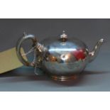 A late Victorian Regimental silver teapot, having scroll handle, bearing crest with tiger above