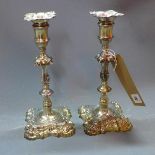 A pair of Georgian silver candlesticks, with shell and foliate design, William Cafe, London 1763,