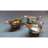 A Walker & Hall silver sauce boat, Chester 1938, together with a 19th century silver sauce boat,