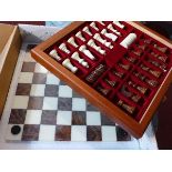 An Italian Chiellini chess set, with board, chess pieces and chequers, 34 x 34cm