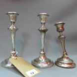 A pair of filled silver candlesticks, Birmingham 1911, makers mark L&S, together with a filled