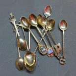 A collection of silver and white metal spoons