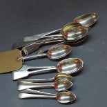 A pair of Georgian silver serving spoons, London 1780, makers mark CH, together with a set of six