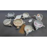 A collection of eight porcelain feeding cups, of various sizes and forms, (8)