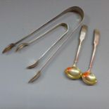 A Georgian silver pair of sugar tongs, makers mark TW & JH together with a pair of Georgian silver