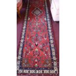 A fine North West Persian Farahan runner, 388cm x 85cm, repeating stylised floral motifs on a
