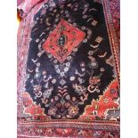 A fine North West Persian Hamadan carpet, 281cm x 177cm, central diamond medallion on a cark field