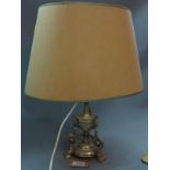 A Regency silver plated lamp base, converted later to electricity, with shade. H.48cm