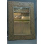 A Contemporary mirror with stud bound border. 120x85cm