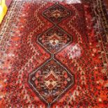 A fine South West Persian Qashqai carpet, 290cm x 216cm, triple pole medallion within repeating