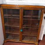 A 19th century mahogany bookcase with two glazed doors raised on bracket feet. H-120 W-108 D-26cm