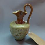 An Arts and Crafts Doulton Lambeth jug. H.20cm