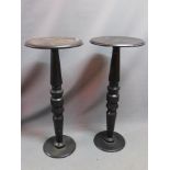 A pair of black painted pedestals. H-106cm