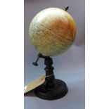 An early 20th century miniature terrestrial globe by Jules Forest, c.1910, on ebonised base, H. 32cm