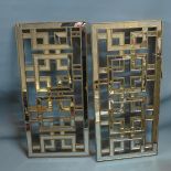 A pair of Contemporary mirrored wall plaques.
