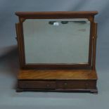 An Edwardian mahogany vanity mirror, with two drawers, beveled glass plate, raised on bracket