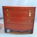 A 19th century mahogany bow front chest of three short over three long drawers raised on splayed