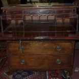 A Regency mahogany secretaire chest, with pull out desk, above three drawers, raised on splayed