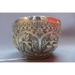 An Indian white metal bowl, repousse embossed with deities within floral border, approx 5 troy oz,