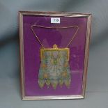 An Art Nouveau mesh evening bag, framed and glazed.