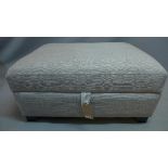 A Contemporary Ottoman, having stone linen upholstery, raised on bracket feet, H. 45cm W. 95cm W.