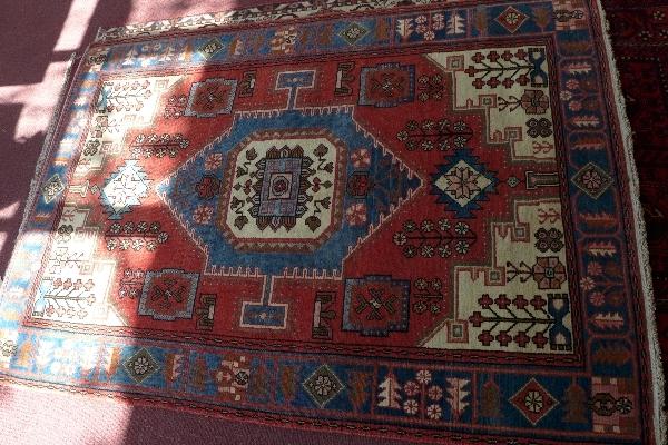 A fine North West Persian Nahawand rug, Central diamond medallion on a terracotta field within