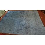 A hand knotted wool viscose Bhadohi carpet, on a blue ground, 306 x 240 cm