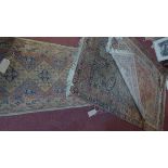 A collection of four Persian rugs, various sizes