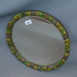 An early 20th century circular mirror, the plaster border molded with fruit, diameter 40cm